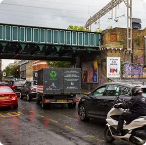 A small billboard in a busy urban area