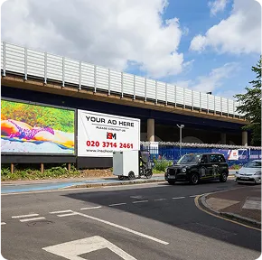 Two billboards near a junction below an overpass